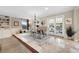 Light-filled dining room featuring a table, chandelier, and French doors at 1804 Wind Willow Rd, Belle Isle, FL 32809