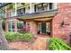 Brick home showcasing a beautiful entrance with a welcoming front porch at 1804 Wind Willow Rd, Belle Isle, FL 32809