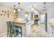 Kitchen featuring white cabinets, stone countertops, and stainless-steel appliances at 1804 Wind Willow Rd, Belle Isle, FL 32809