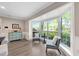 Sitting area with large bay windows and a charming decorative cabinet at 1804 Wind Willow Rd, Belle Isle, FL 32809