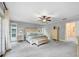 Spacious main bedroom with neutral walls, carpet, ceiling fan and natural light at 1804 Wind Willow Rd, Belle Isle, FL 32809