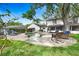 Beautiful backyard showcasing a pool, patio area, and outdoor seating under mature trees at 1804 Wind Willow Rd, Belle Isle, FL 32809