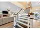 Elegant staircase leading to the second floor, with an open view of the living room at 1804 Wind Willow Rd, Belle Isle, FL 32809