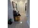 Hallway with tile floors and closet at 1808 4Th Se Ct, Winter Haven, FL 33880