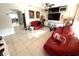 Bright living room with tile floors, ceiling fan, and ample space at 1808 4Th Se Ct, Winter Haven, FL 33880