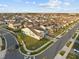 Aerial view of a residential community with tree-lined streets and sidewalks at 19307 Banfield Pl, Orlando, FL 32827