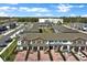 Aerial view of townhomes in a well-maintained community with ample parking at 208 Cape Honeysuckle Pl, Sanford, FL 32771