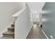 Hallway with wood flooring and a staircase leading to the upper level at 208 Cape Honeysuckle Pl, Sanford, FL 32771