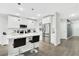 Modern kitchen with stainless steel appliances, quartz countertops, and pendant lighting at 208 Cape Honeysuckle Pl, Sanford, FL 32771