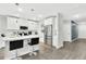 Modern kitchen with stainless steel appliances, quartz countertops, and pendant lighting at 208 Cape Honeysuckle Pl, Sanford, FL 32771