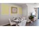 Cozy dining area featuring decor, round table with four chairs, modern lighting and neutral color palette at 2148 Monteverde Ave, Davenport, FL 33896