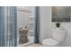 Elegant bathroom featuring a tiled shower, blue curtain, and stylish decor at 2152 Monteverde Ave, Davenport, FL 33896