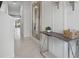 Bright foyer features a large mirror, console table and tile flooring leading into the home at 2152 Monteverde Ave, Davenport, FL 33896