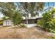 Large backyard with a screened in porch, a shed, and lots of mature trees at 257 Sheppard St, Altamonte Springs, FL 32701