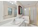 Well-lit bathroom featuring a shower, large mirror and sink with storage space underneath at 257 Sheppard St, Altamonte Springs, FL 32701