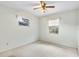 This bedroom features neutral walls, ceiling fan, and two windows allowing natural light at 257 Sheppard St, Altamonte Springs, FL 32701