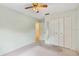 Bright bedroom with a ceiling fan, closet, and pale green walls at 257 Sheppard St, Altamonte Springs, FL 32701