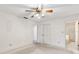 Bedroom features neutral carpet, ceiling fan, closet and en suite bathroom at 257 Sheppard St, Altamonte Springs, FL 32701