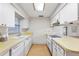 Functional kitchen with linoleum countertops, appliances, and a sunlit window at 257 Sheppard St, Altamonte Springs, FL 32701