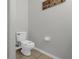 Simple and clean bathroom with tiled floors and modern toilet at 3133 Yellow Lantana Ln, Kissimmee, FL 34747