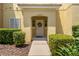 Inviting front entrance with decorative wreath and well-maintained landscaping at 3133 Yellow Lantana Ln, Kissimmee, FL 34747