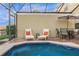 Inviting screened pool boasts a spa, lounge chairs, dining table, and a relaxing atmosphere at 3133 Yellow Lantana Ln, Kissimmee, FL 34747