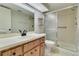 Updated full bathroom with a spacious vanity, mirror and step-in shower at 3467 Flossmoor Ave # 101, Orlando, FL 32822