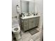 Updated bathroom featuring a gray vanity and sleek countertop at 417 Evesham Pl, Longwood, FL 32779