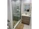 Bathroom featuring updated shower, vanity, and patterned tile floor at 417 Evesham Pl, Longwood, FL 32779