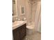 Bright bathroom with a white sink, stylish vanity and shower-tub combination at 419 Aldama Ave, Lady Lake, FL 32159