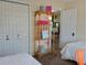 Bedroom featuring closet with organizer, beds and decor at 419 Aldama Ave, Lady Lake, FL 32159