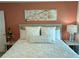 Inviting bedroom featuring a comfortable bed with stylish headboard and art piece at 419 Aldama Ave, Lady Lake, FL 32159