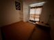 Bedroom view features neutral walls, tile flooring, closet and window to let natural sunlight in at 4954 Luna Negra Dr, Orlando, FL 32811