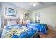 Cozy bedroom with twin beds, cartoon bedding, and natural light at 5007 Laguna Bay Cir # 31, Kissimmee, FL 34746