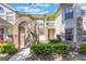 Charming condo building with brick archway and well-maintained landscaping at 5007 Laguna Bay Cir # 31, Kissimmee, FL 34746