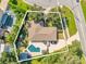 An aerial view of a home with a pool, patio, driveway, and well-defined property lines at 5205 Saint Regis Pl, Belle Isle, FL 32812