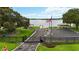 Gated community park entrance with an American flag, a boat launch, a playground, and picnic shelters at 5205 Saint Regis Pl, Belle Isle, FL 32812