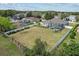 Aerial view of a well-maintained home featuring a large backyard with a screened-in swimming pool at 548 Hebrides Ct, Apopka, FL 32712