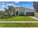 Charming single-story home with a well-manicured lawn and a two-car garage at 548 Hebrides Ct, Apopka, FL 32712