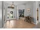 Bright foyer features tile flooring and a decorative front door with sidelights at 548 Hebrides Ct, Apopka, FL 32712