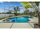 Inviting screened-in swimming pool offers a refreshing escape with clear blue water and mature landscaping at 548 Hebrides Ct, Apopka, FL 32712