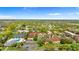 Aerial view of the community showcasing mature landscaping, pool, and tennis courts at 6007 Scotchwood Gln # 37, Orlando, FL 32822