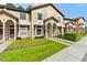 Welcoming townhome with lush lawn and mature shrubs at 6007 Scotchwood Gln # 37, Orlando, FL 32822