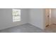 Bright, tiled bedroom featuring a window and a closet at 6140 Shavasana Rd, Clermont, FL 34714