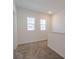 Upstairs loft features plush carpet and two windows bringing in natural light at 6140 Shavasana Rd, Clermont, FL 34714