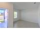 Bright, sunlit room with neutral tile flooring, offering a versatile space for various uses at 6230 Shavasana Rd, Clermont, FL 34714