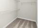 Walk-in closet with carpeted floor and white wire shelving for optimal storage at 6383 Trailblaze Bnd, St Cloud, FL 34771