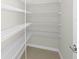 Walk-in closet with multiple levels of wire shelving for organized storage at 6383 Trailblaze Bnd, St Cloud, FL 34771