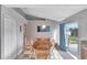 Dining room featuring a wooden table set and view of the backyard through the sliding glass door at 647 Holbrook Ave, Deltona, FL 32738