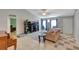 Spacious living room featuring neutral colors and a tile floor with a piano in view at 647 Holbrook Ave, Deltona, FL 32738